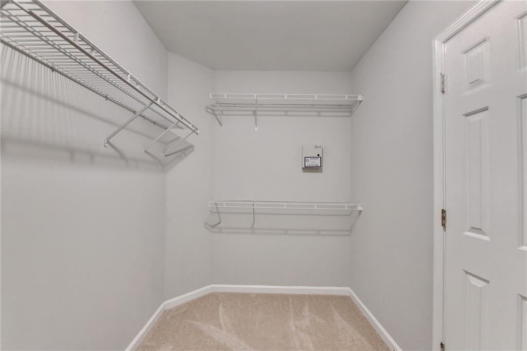 655 Golden Meadows Lane Suwanee, GA 30024 - Photo 37 of 72 a view of walk in closet
