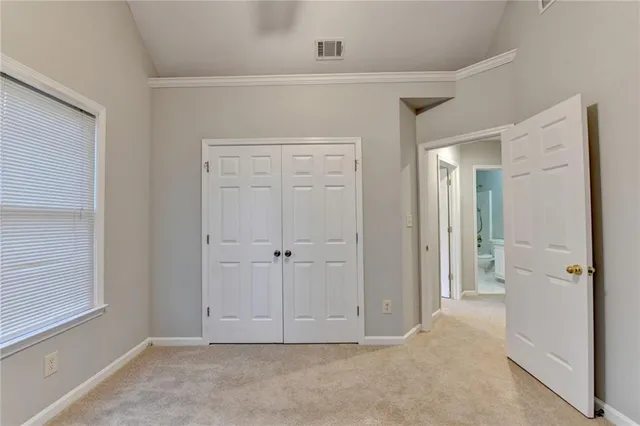 a living room with furniture and a ceiling fan