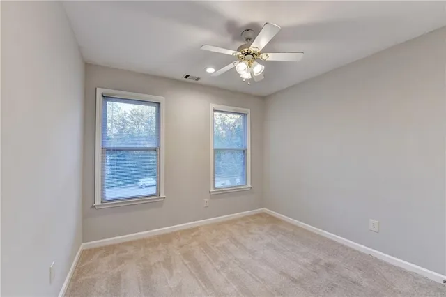 a view of an empty room and window
