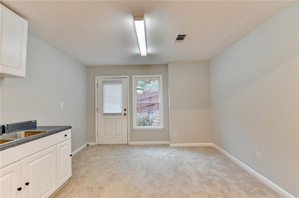 655 Golden Meadows Lane Suwanee, GA 30024 - Photo 50 of 72 a view of an empty room and window