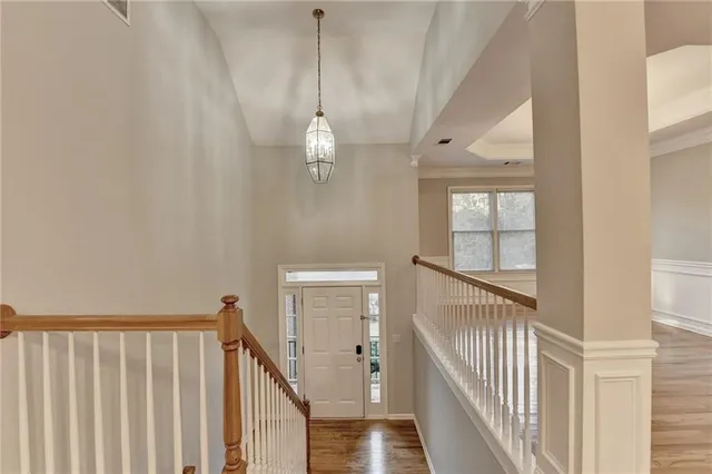 a view of a hallway with windows