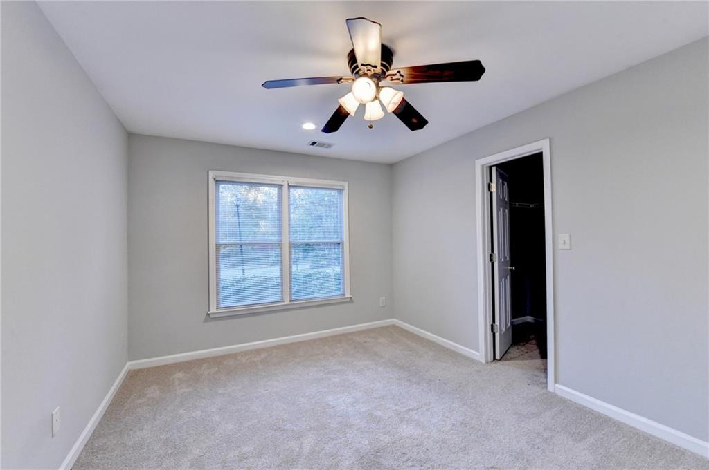 655 Golden Meadows Lane Suwanee, GA 30024 - Photo 54 of 72 a view of an empty room with a window