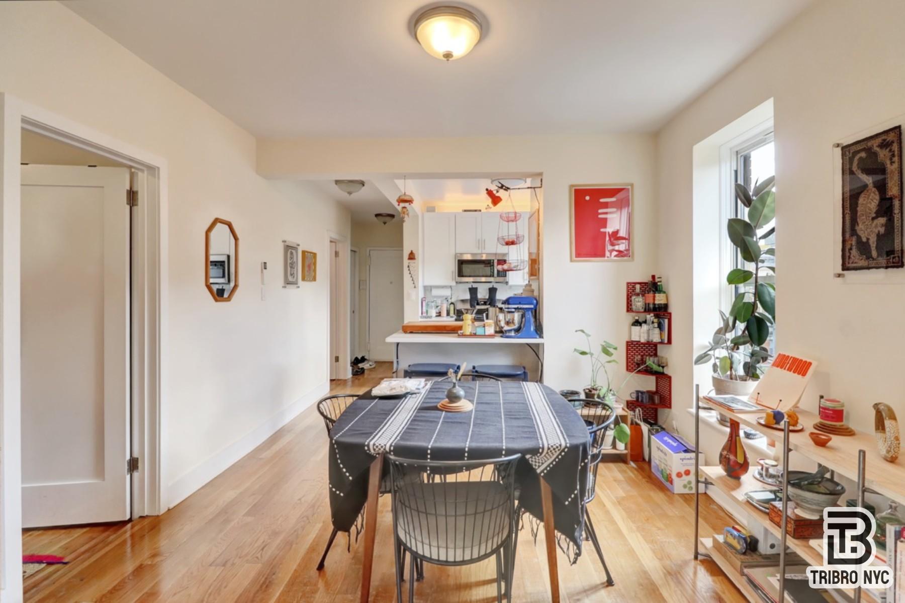 955 Seneca Avenue, Unit 3D Queens, NY 11385 - Photo 2 of 7 a view of a dining room with furniture and wooden floor