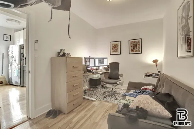 a bed room with furniture and a window