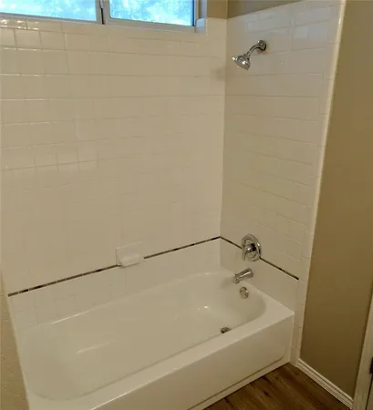 a bathroom with a white bath tub