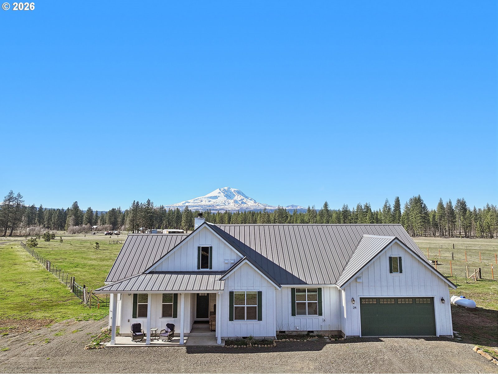 24 Bacon Creek Road Glenwood, WA 98619 - Photo 1 of 48 a view of a house with a big yard and large trees
