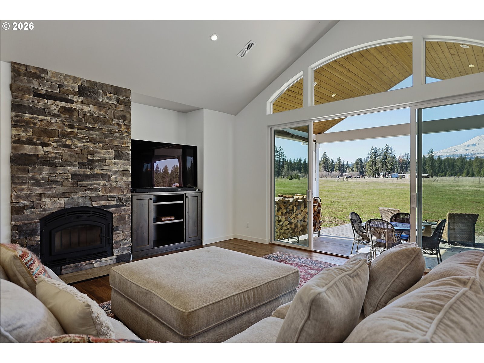 24 Bacon Creek Road Glenwood, WA 98619 - Photo 11 of 48 a living room with furniture fireplace and flat screen tv