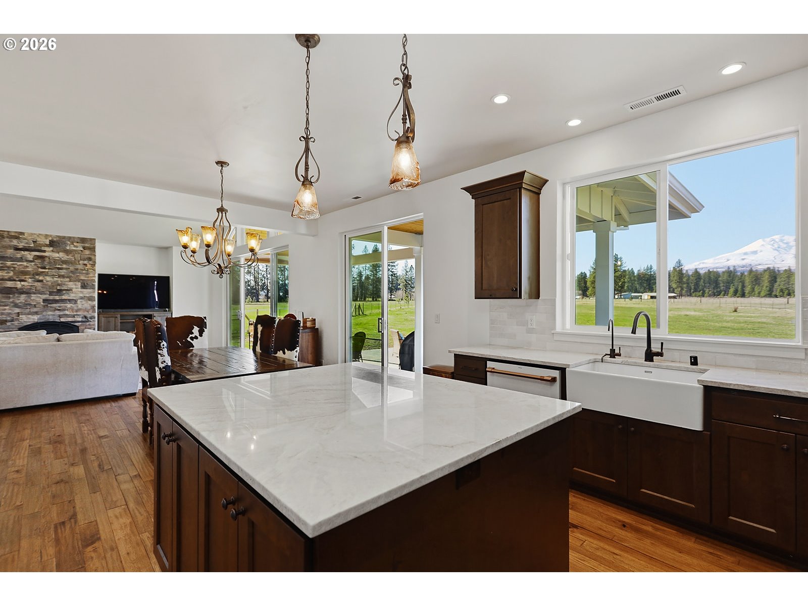 24 Bacon Creek Road Glenwood, WA 98619 - Photo 19 of 48 a kitchen with sink cabinets and dining table