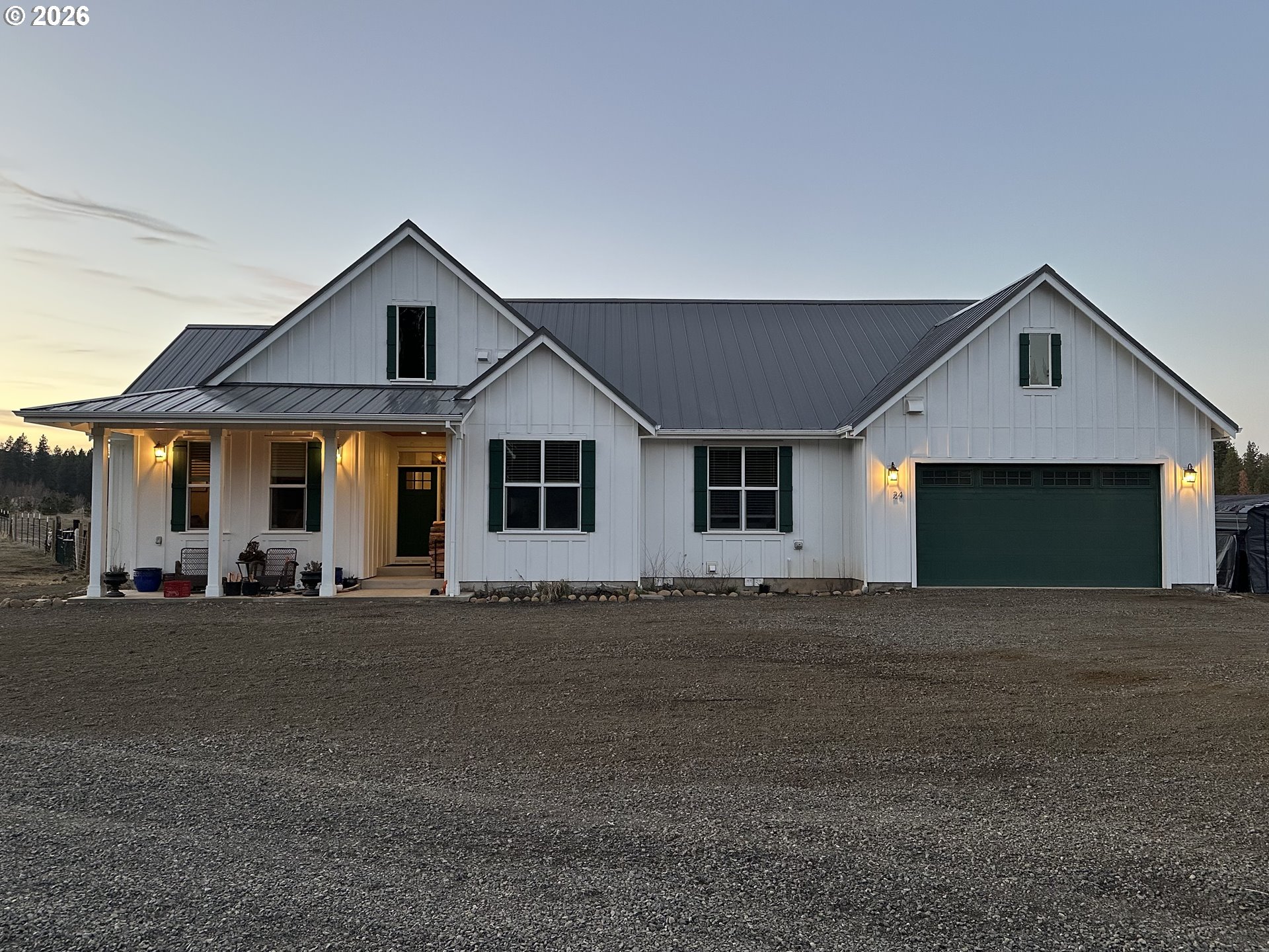 24 Bacon Creek Road Glenwood, WA 98619 - Photo 2 of 48 a front view of a house with outdoor space and parking