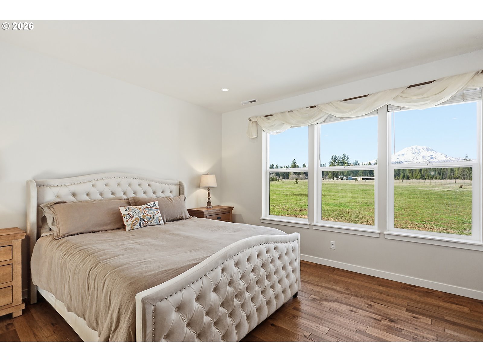 24 Bacon Creek Road Glenwood, WA 98619 - Photo 24 of 48 a bedroom with a large window and a bed