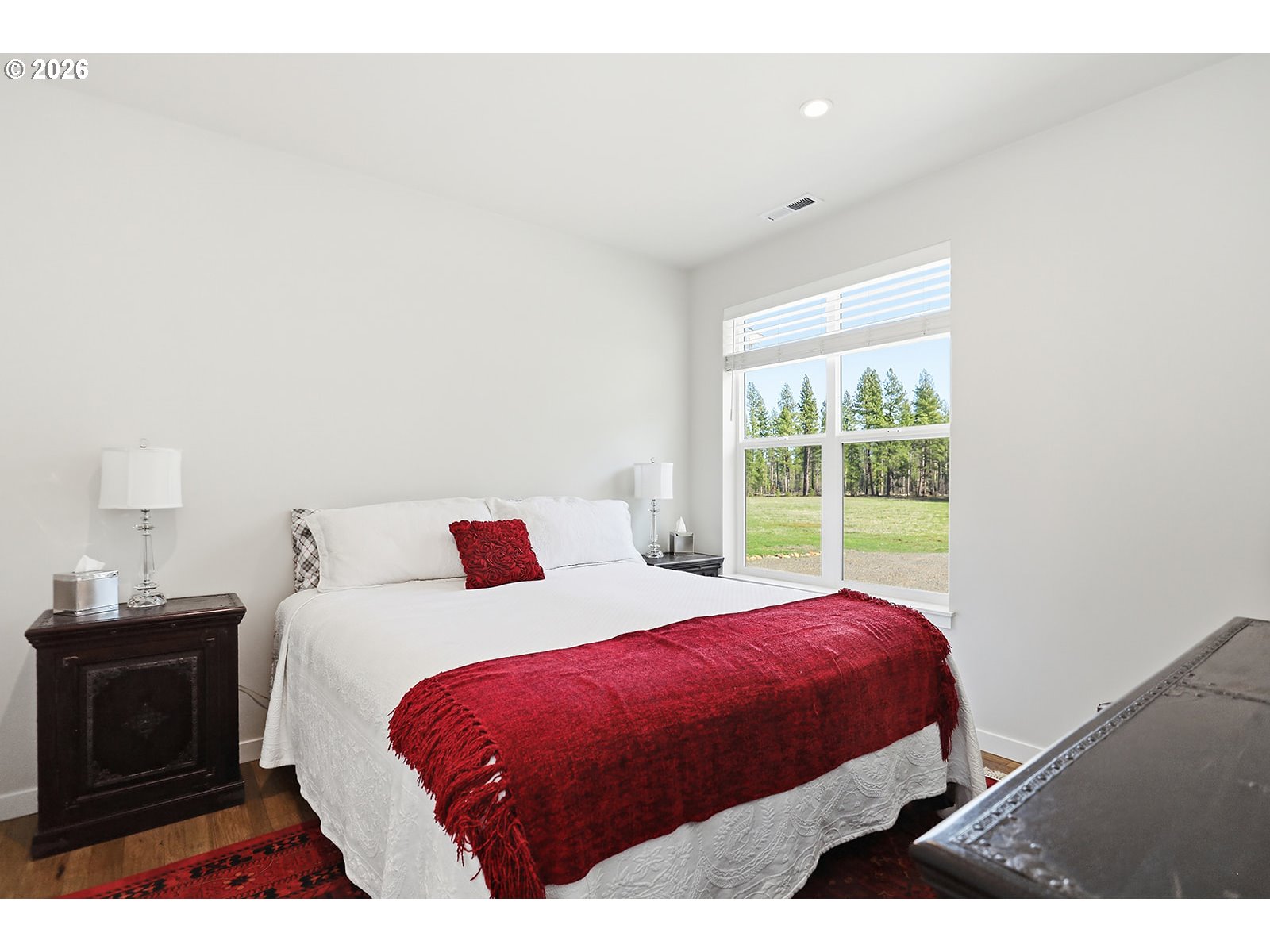 24 Bacon Creek Road Glenwood, WA 98619 - Photo 31 of 48 a bedroom with a bed and a window