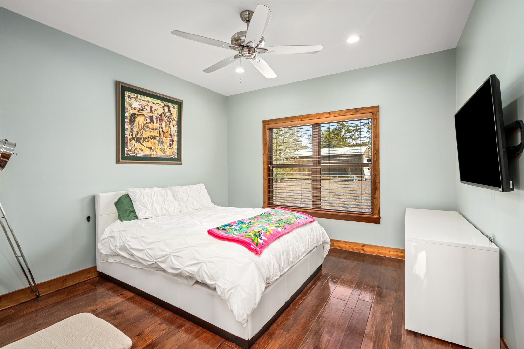 120 State Loop 92 La Grange, TX 78945 - Photo 29 of 50 a bedroom with a bed and a flat screen tv