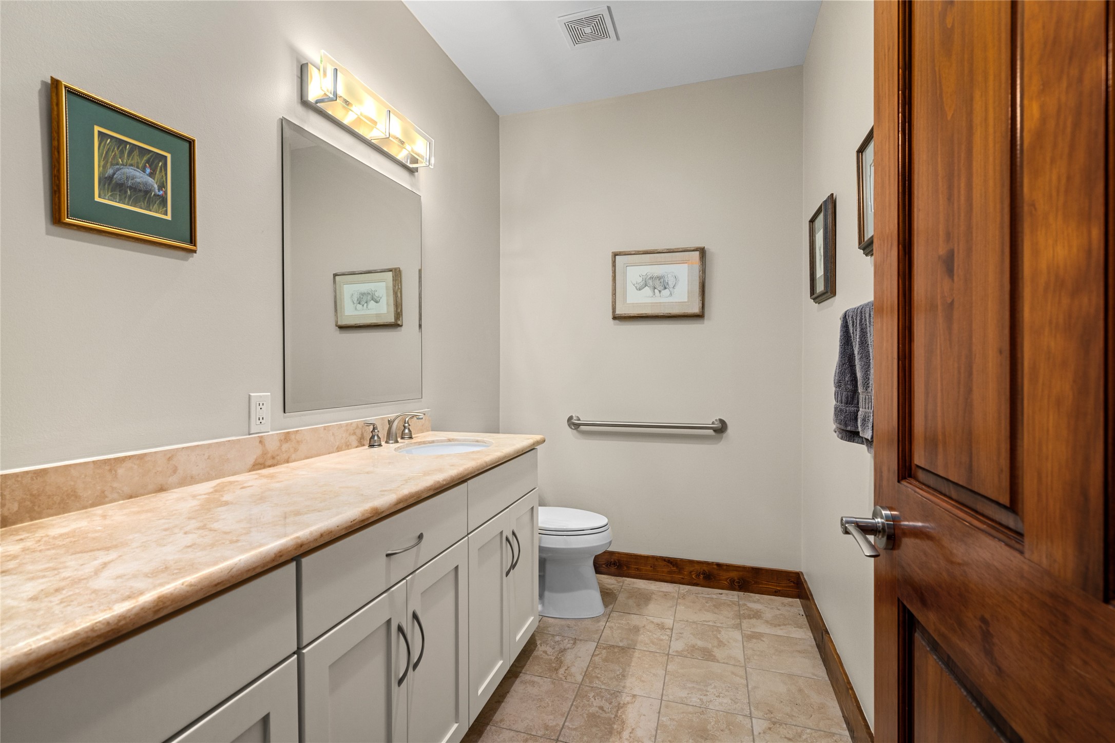120 State Loop 92 La Grange, TX 78945 - Photo 31 of 50 a bathroom with a sink a toilet and a large mirror