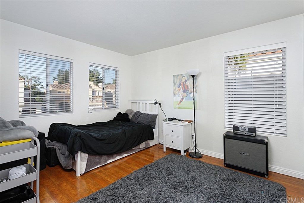 3660 Via Bernardo Oceanside, CA 92056 - Photo 25 of 34 a bedroom with a bed and a window