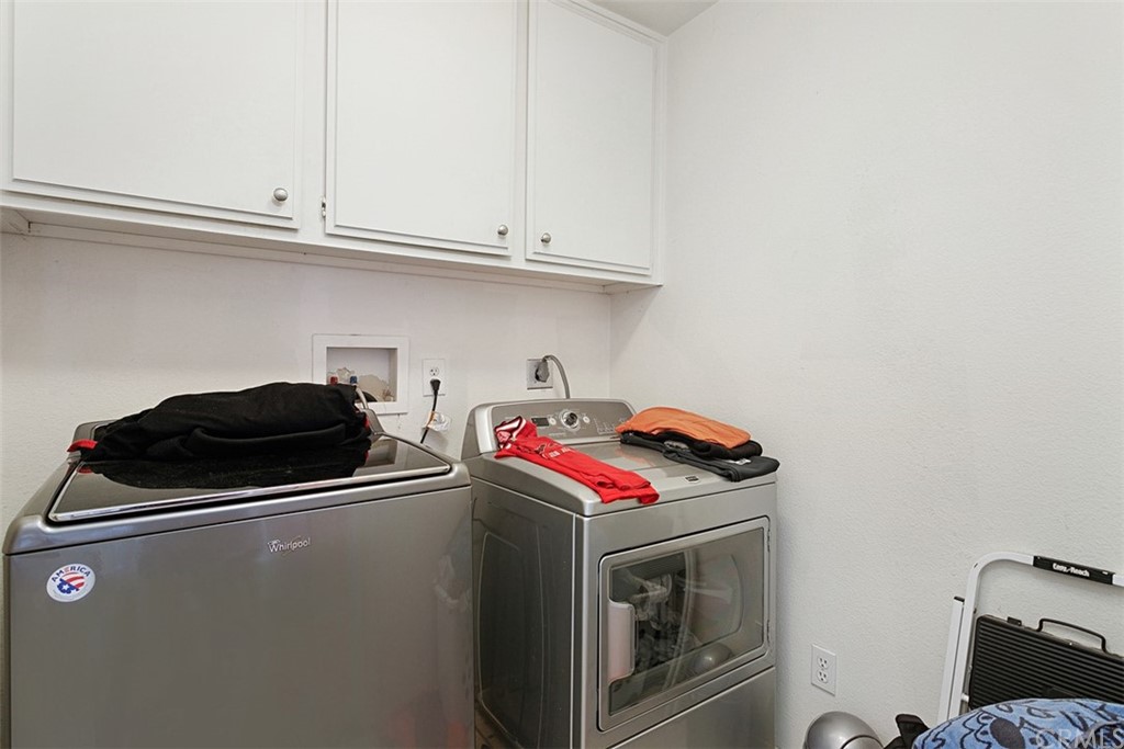 3660 Via Bernardo Oceanside, CA 92056 - Photo 27 of 34 a utility room with dryer and washer