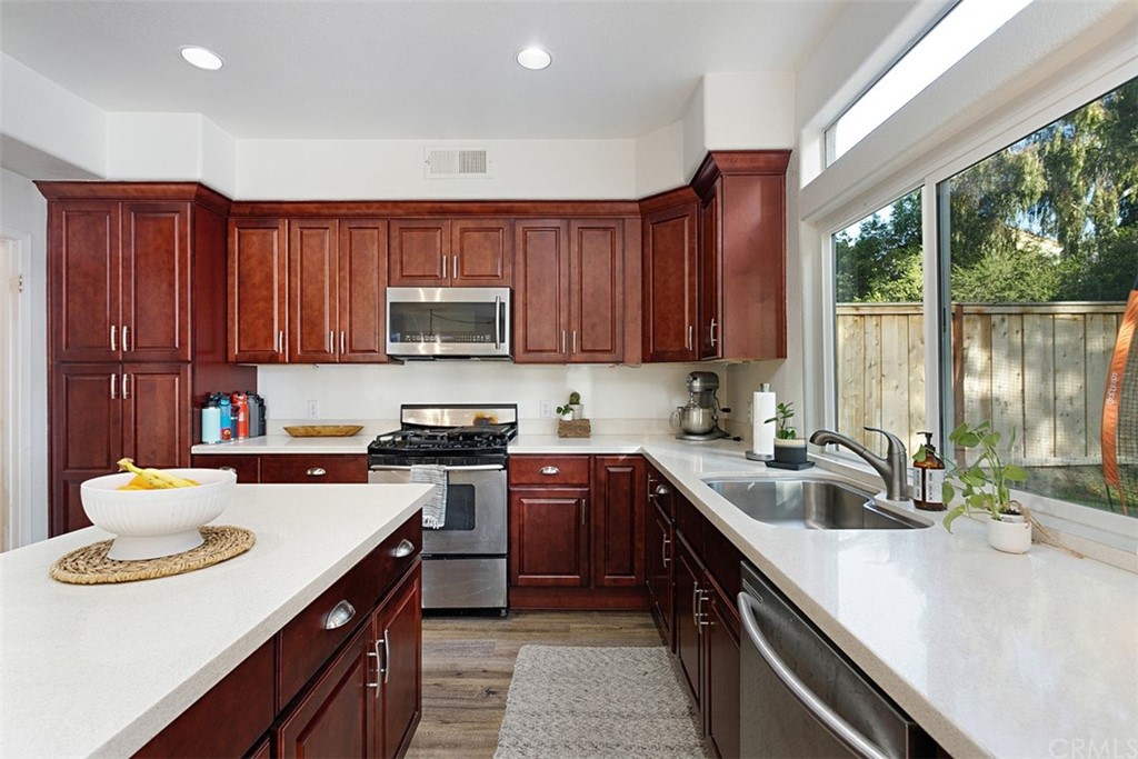 3660 Via Bernardo Oceanside, CA 92056 - Photo 7 of 34 a kitchen with a sink appliances and cabinets