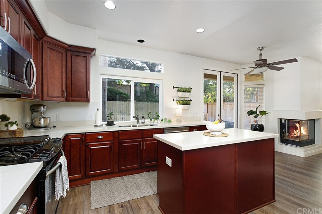 3660 Via Bernardo Oceanside, CA 92056 - Photo 8 of 34 a kitchen with a sink stove and cabinets