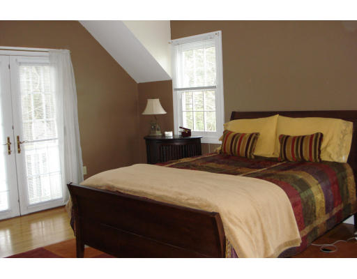 34 White Pine Road Newton, MA 02464 - Photo 13 of 15 a bedroom with a bed and wooden floor