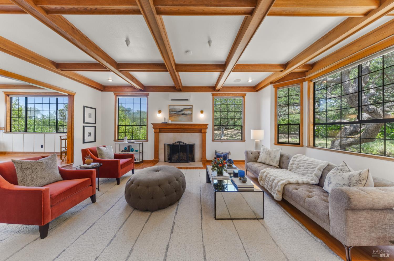 10 Lockton Lane Novato, CA 94945 - Photo 10 of 68 A wood-burning fireplace anchors the living room, while expansive windows bring the peaceful Green Point landscape indoors.