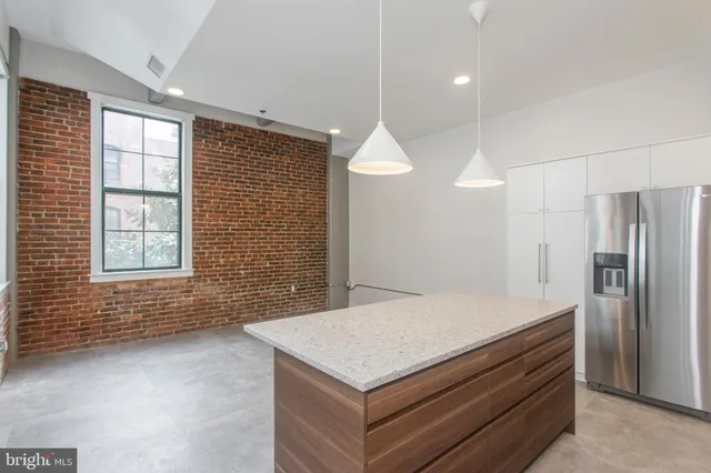 a kitchen with a stove and a refrigerator