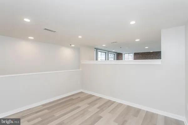 a bathroom with a shower a toilet and sink