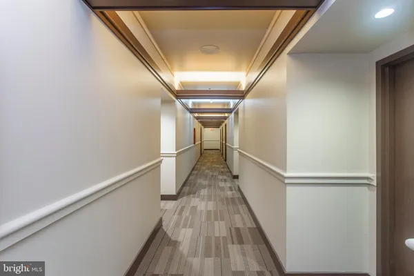 a view of a patio with a dining table and chairs with wooden floor