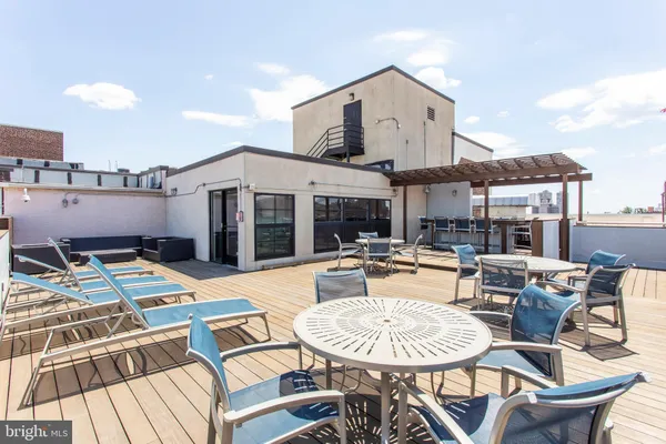 a view of a chairs and table in a patio