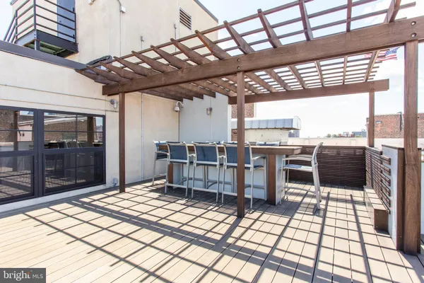 a view of a terrace with seating area