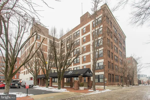 a front view of a building with street view