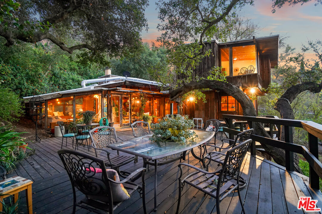 an outdoor space with furniture and umbrella