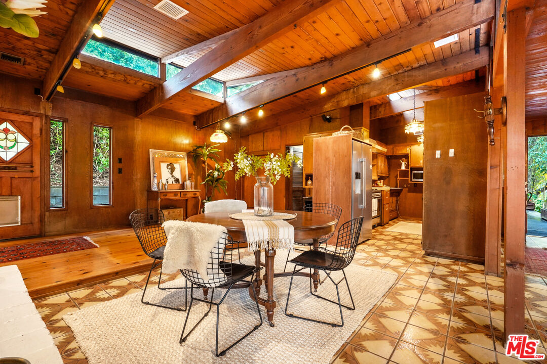20881 Waveview Drive Topanga, CA 90290 - Photo 12 of 54 a view of a patio with table and chairs and potted plants