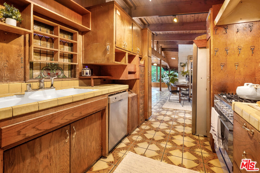 20881 Waveview Drive Topanga, CA 90290 - Photo 19 of 54 a spacious bathroom with a double vanity sink a mirror and a shower
