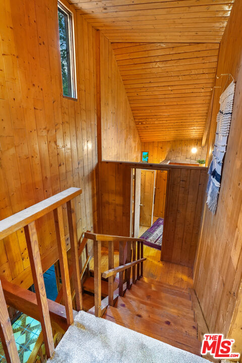 20881 Waveview Drive Topanga, CA 90290 - Photo 32 of 54 a view of staircase with wooden floor and a potted plant