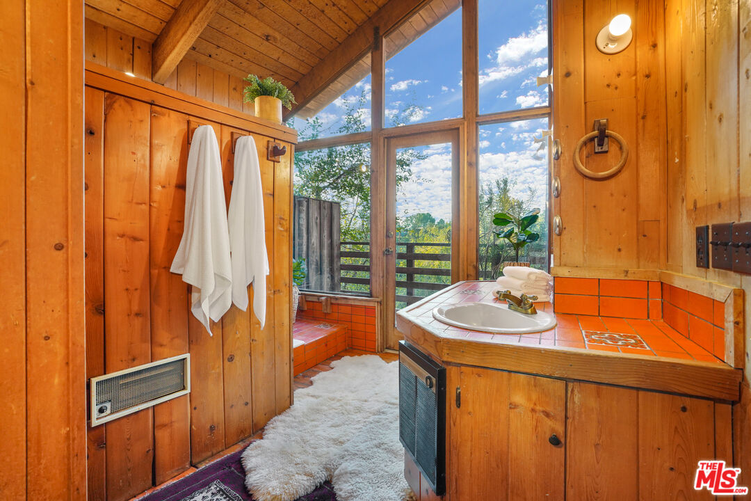 20881 Waveview Drive Topanga, CA 90290 - Photo 38 of 54 a dining room with furniture and a window