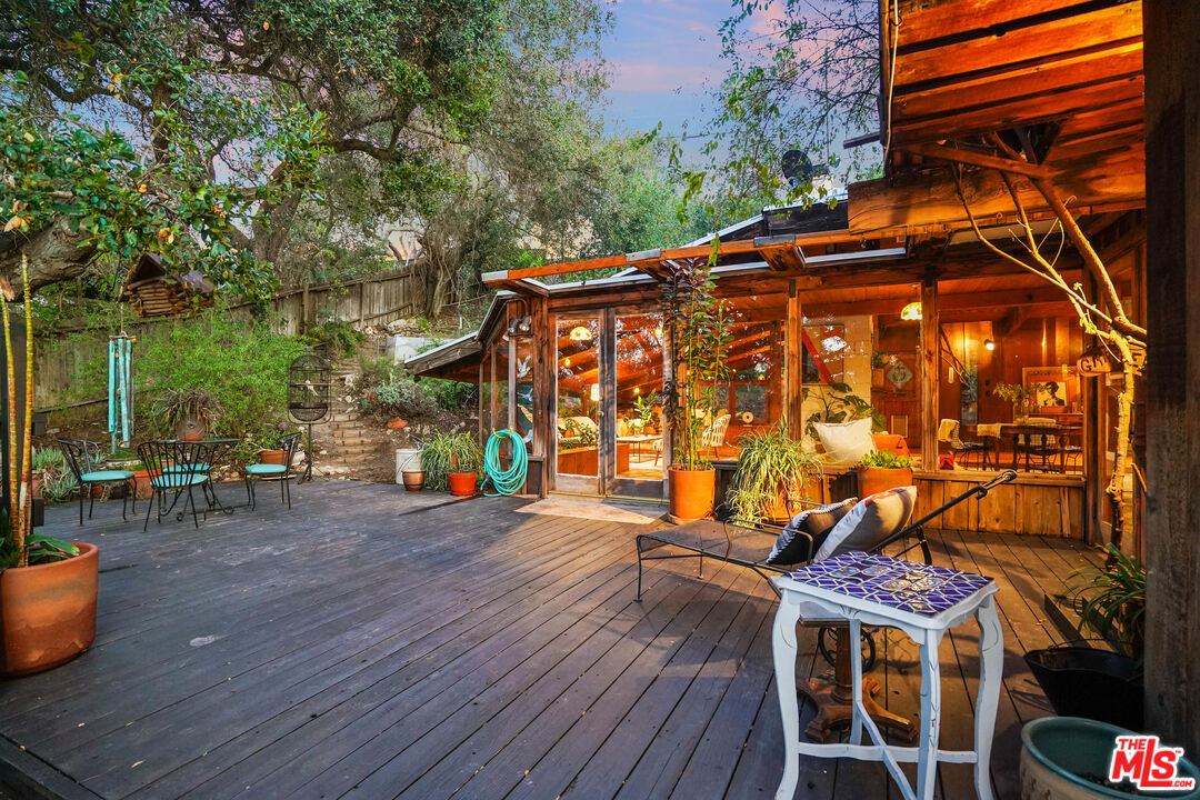 20881 Waveview Drive Topanga, CA 90290 - Photo 44 of 54 a view of a chairs and table on the wooden floor