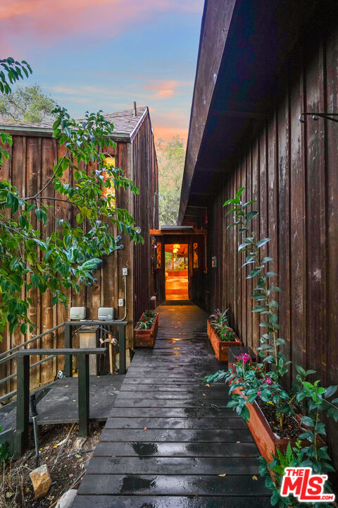 20881 Waveview Drive Topanga, CA 90290 - Photo 48 of 54 a living room filled with furniture and a potted plant