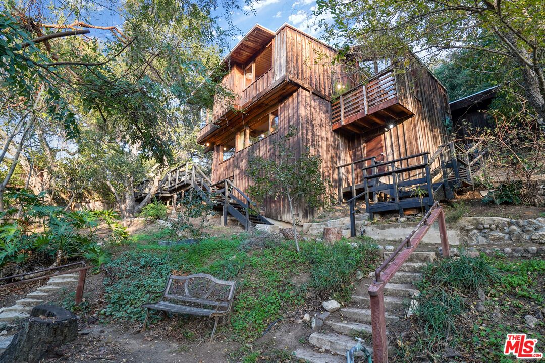 20881 Waveview Drive Topanga, CA 90290 - Photo 6 of 54 a front view of a house with a yard