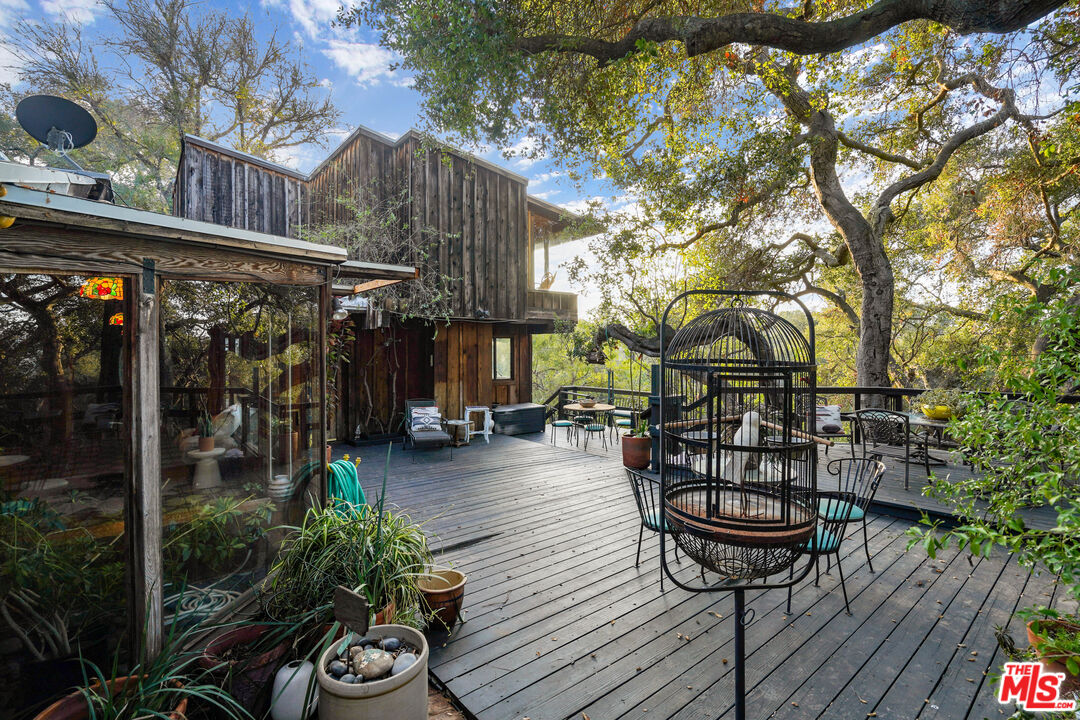 20881 Waveview Drive Topanga, CA 90290 - Photo 7 of 54 a view of a chairs and table in a patio