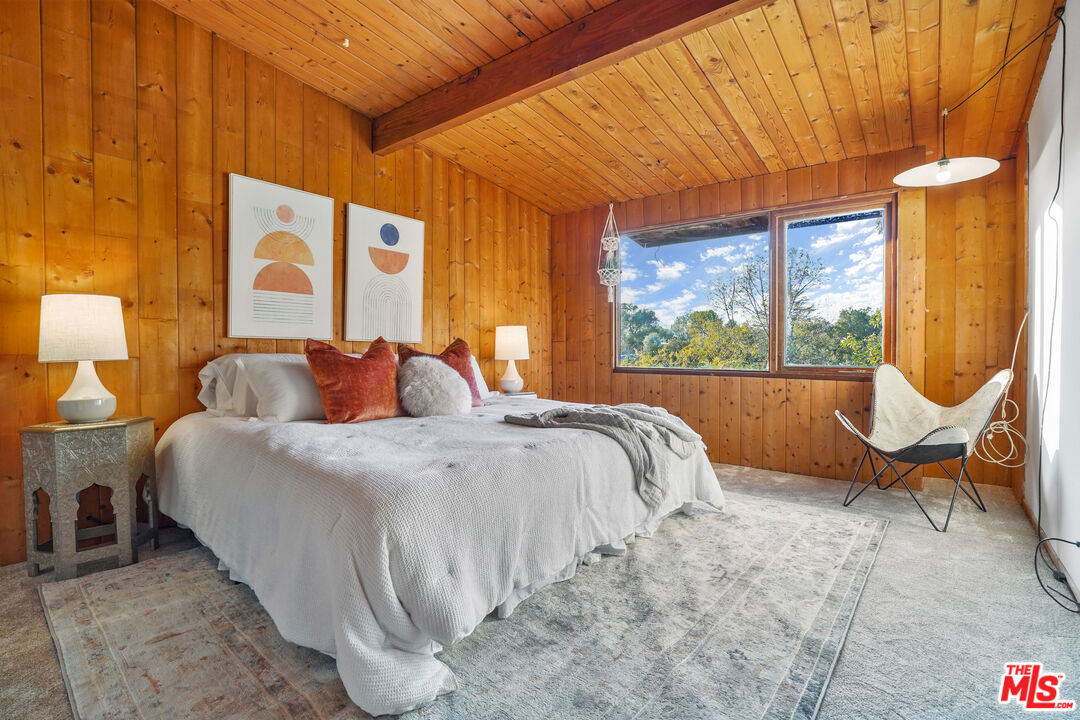 20881 Waveview Drive Topanga, CA 90290 - Photo 8 of 54 a bedroom with a bed chair and window