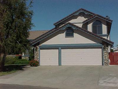 7273 Roxanne Lane Rohnert Park, CA 94928 - Photo 1 of 9 a front view of a house with a yard garage and garage
