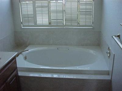 7273 Roxanne Lane Rohnert Park, CA 94928 - Photo 7 of 9 a close up of a bathtub in a bathroom