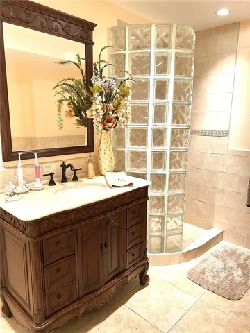 a bathroom with a sink double vanity and a mirror