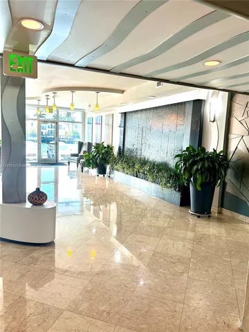 a view of an entryway with a flower pot