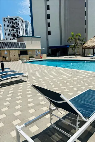a view of a swimming pool with an outdoor space