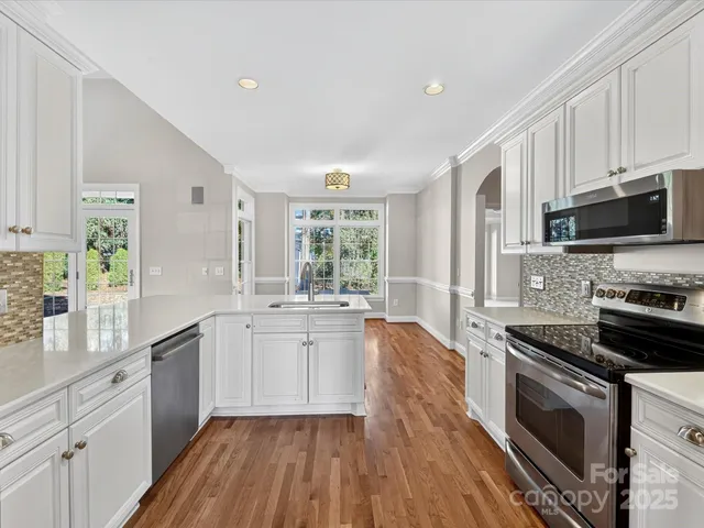 a large kitchen with a stove top oven