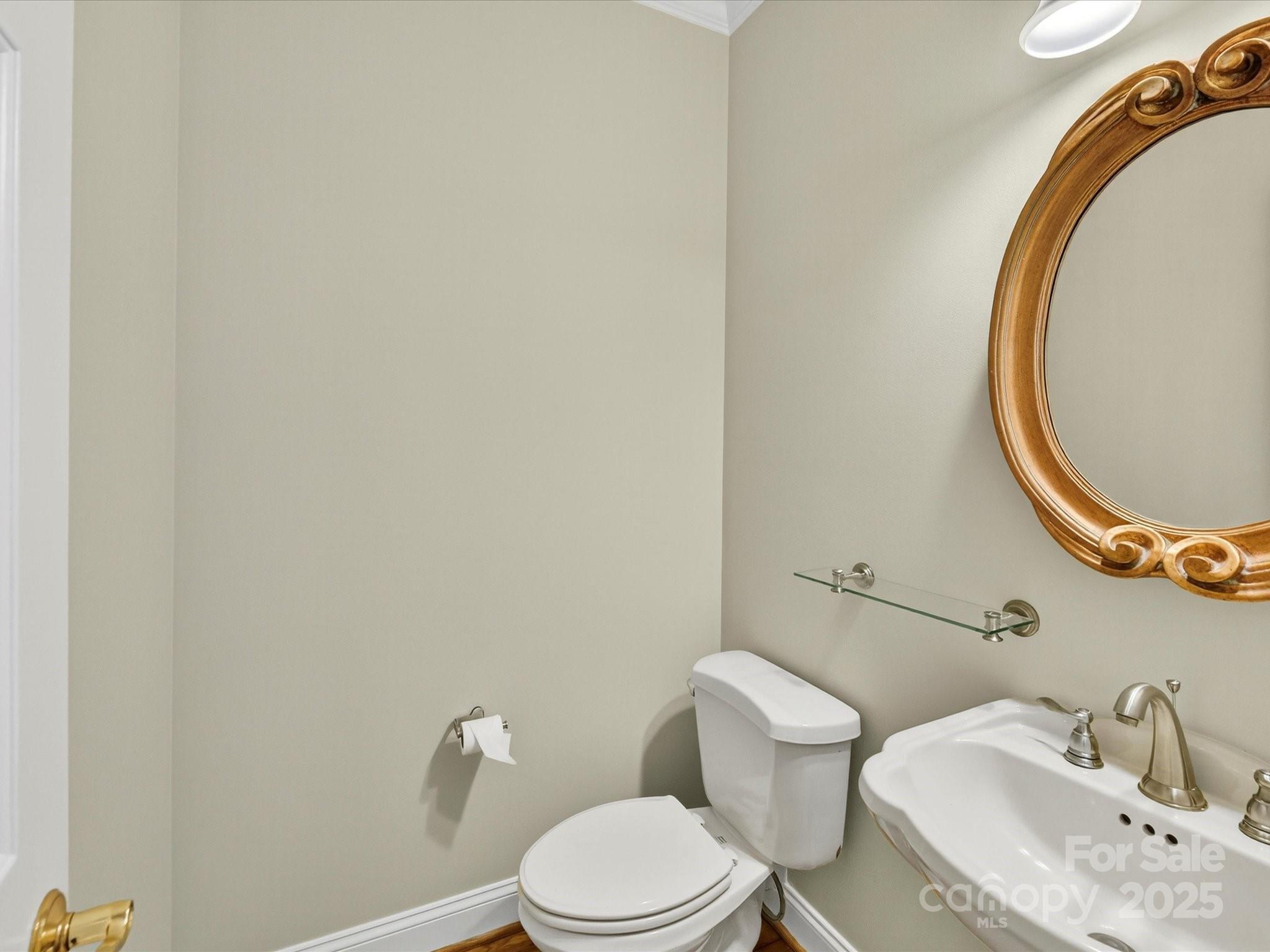 21410 Pinecrest Place Cornelius, NC 28031 - Photo 17 of 43 a bathroom with a toilet and a sink