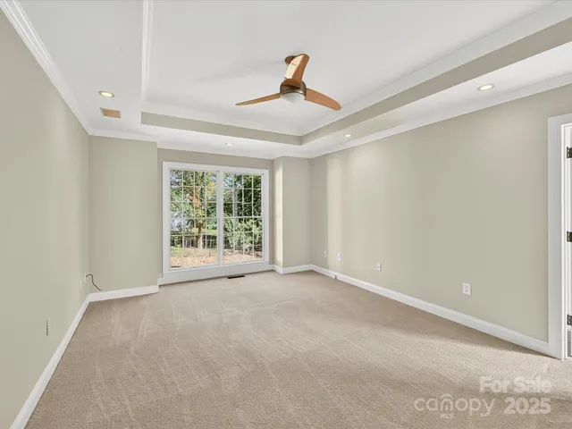 a view of an empty room with windows