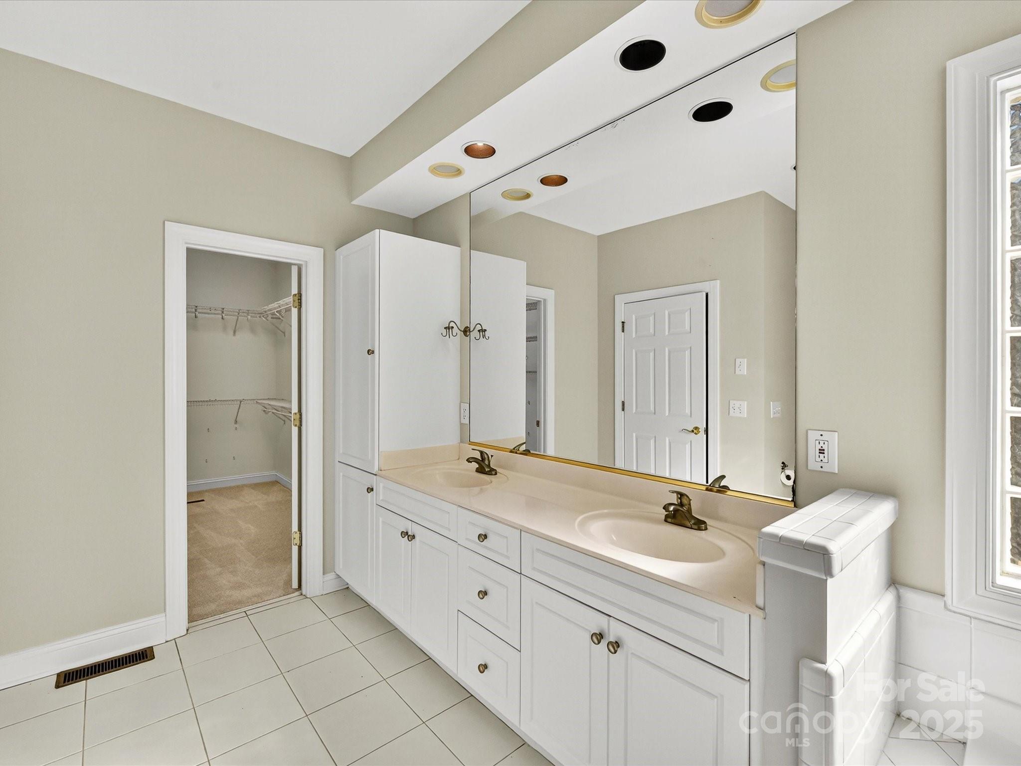 21410 Pinecrest Place Cornelius, NC 28031 - Photo 26 of 43 a bathroom with a double vanity sink mirror and