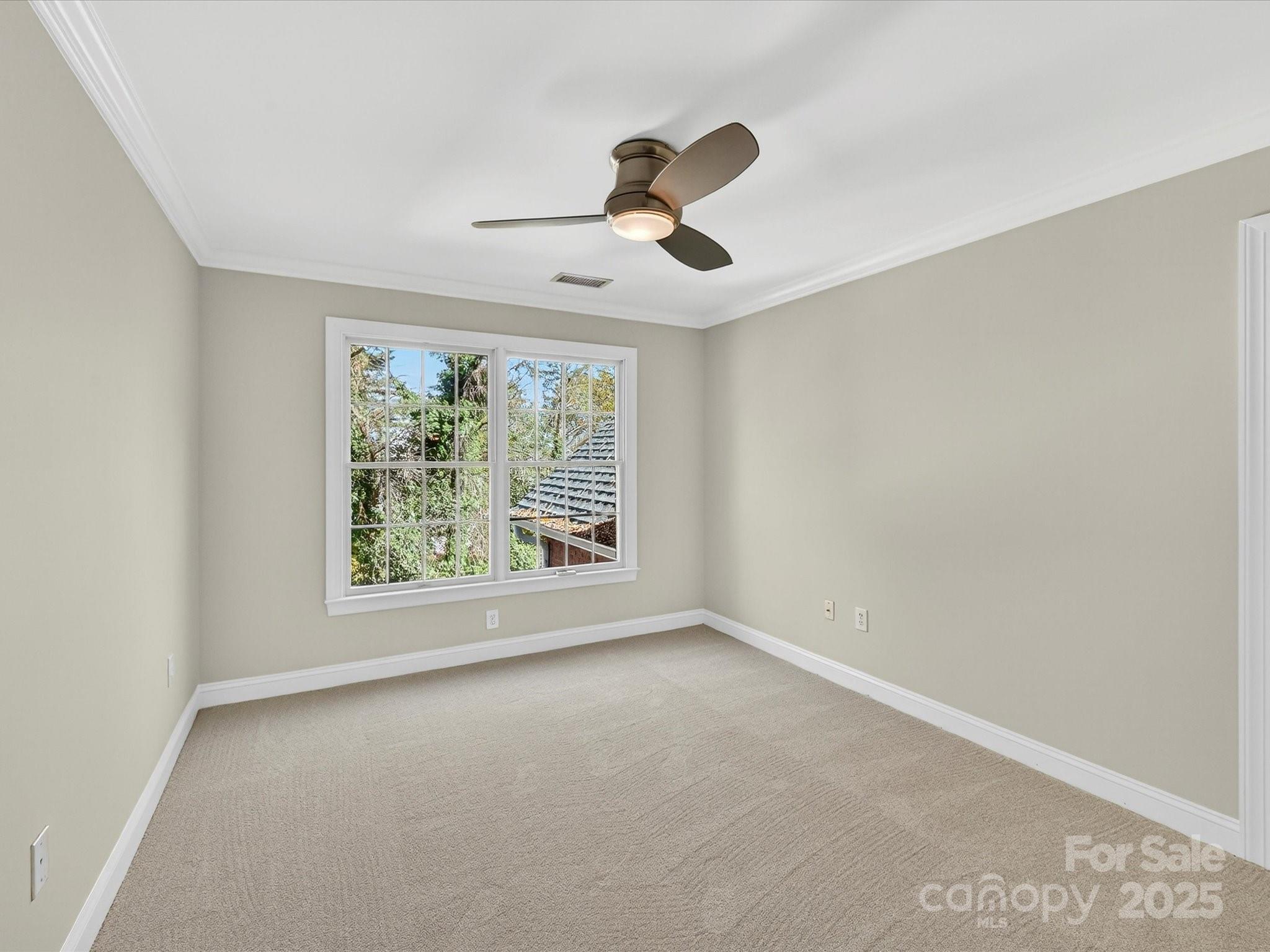 21410 Pinecrest Place Cornelius, NC 28031 - Photo 27 of 43 an empty room with a window