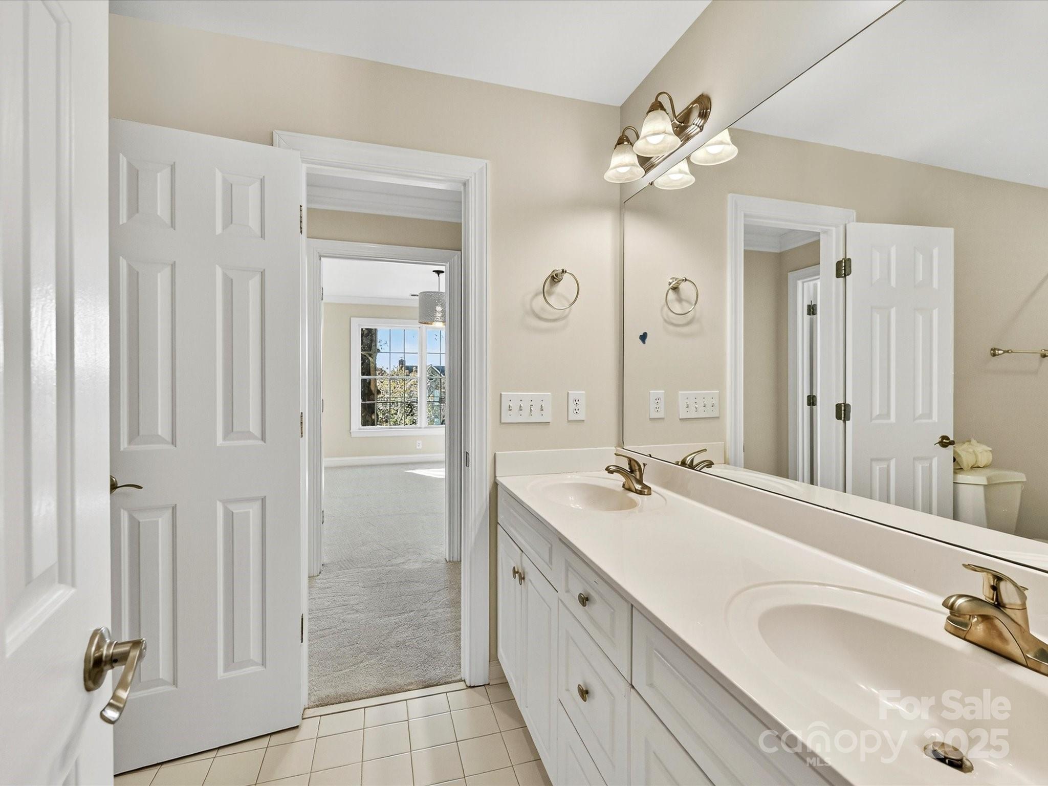 21410 Pinecrest Place Cornelius, NC 28031 - Photo 28 of 43 a spacious bathroom with a double vanity sink mirror and
